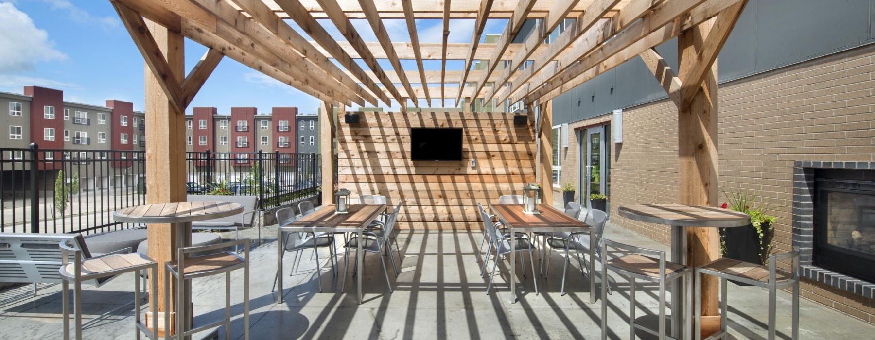 a patio with tables and chairs