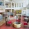 a room with a red carpet and a red rug and a round table