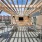 a patio with tables chairs and a tv