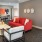 a lounge with a couch and chairs